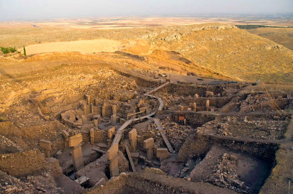 Monumental round-oval buildings with their characteristic T-shaped monolithic pillars at Göbekli Tepe, Turkey. Image credit: Nico Becker, Göbekli Tepe Archive, German Archaeological Institute.