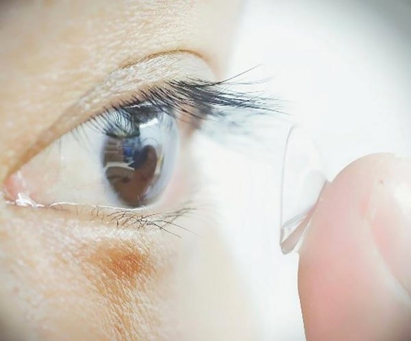 Study participant putting contacts in